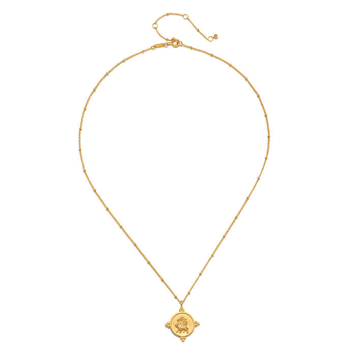 Gold-toned chain necklace with small circular coin pendant featuring embossed deity design and decorative side loops.
