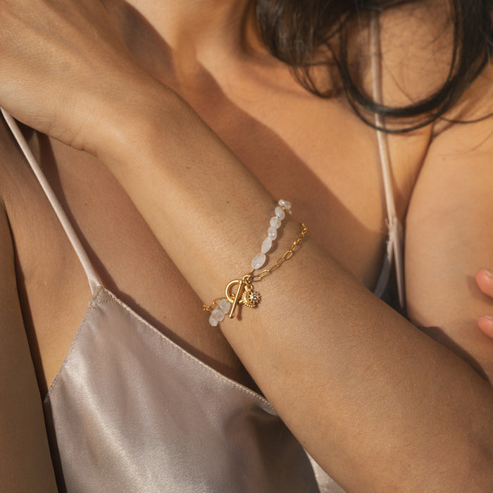 A model wearing the Goddess Wisdom Moonstone Beaded and Chain Toggle Bracelet, highlighting its beauty as a talisman for manifestation and a meaningful piece of spiritual jewelry during meditation.