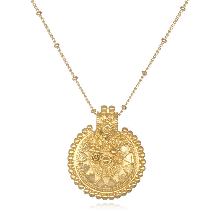 Gold Mandala Necklace featured as spiritual jewelry, symbolizing meditation gifts and meaningful mantra for yoga practices. This sacred piece serves as a protective amulet, embodying the essence of manifestation and symbolism in spiritual growth.