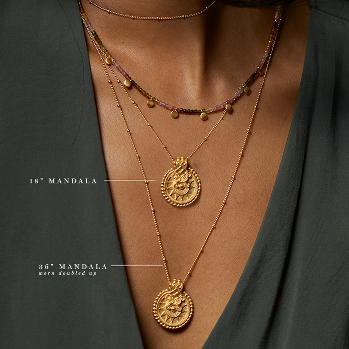 A close-up of the Gold Mandala Necklace layered with another necklace, showcasing its beauty and meaning in spiritual jewelry, perfect for meditation gifts, mantra practices, and embodying the sacred essence of yoga.