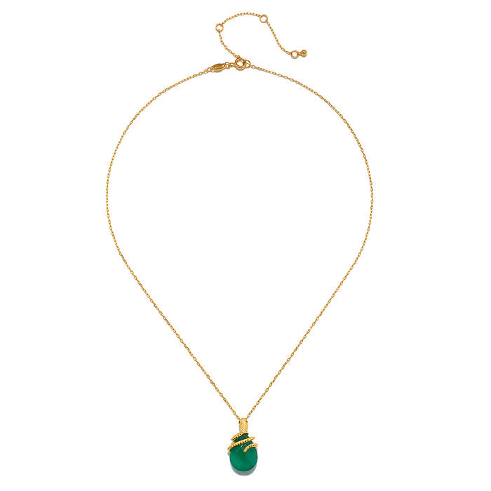 Another view of the Guiding Energy Green Onyx Snake Necklace showcasing the delicate design and elegant gold chain. This piece of spiritual jewelry acts as a powerful talisman, promoting abundance and intuition. Perfect for those interested in yoga and the mystical meanings behind gemstones.