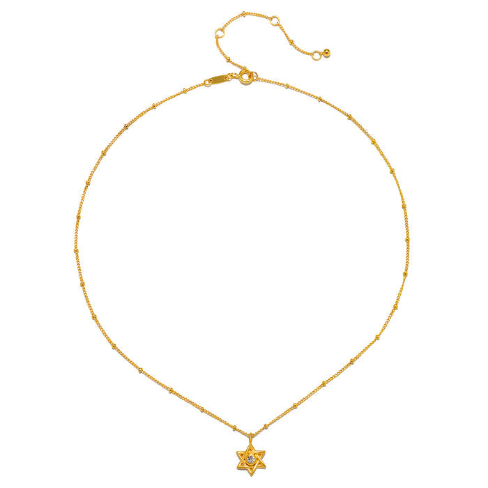 The Guiding Faith Star of David Necklace displayed on a white background, highlighting its intricate design and 18kt gold plating. This spiritual jewelry serves as a powerful talisman for meditation, protection, and meaningful connections in your yoga journey.