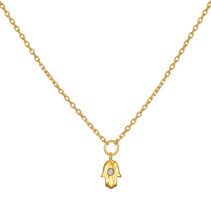 Guiding Hand Mini Hamsa Necklace featuring an 18kt gold plated pendant, ideal for spiritual jewelry and meditation. This talisman promotes protection and embodies meaningful qualities associated with zodiac signs. Perfect for yoga practitioners and those focused on manifestation, this necklace is a charming addition to any collection.
