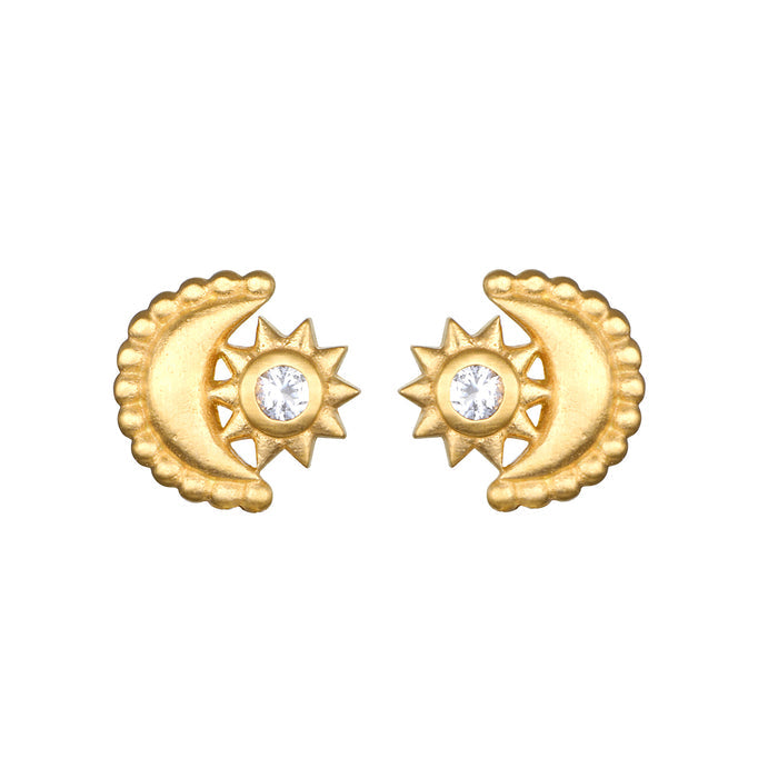 Guiding Star Celestial White Topaz Stud Earrings featuring a crescent moon and sun design, crafted from 18kt gold plated brass and adorned with a clear white topaz stone. These earrings are perfect for providing spiritual jewelry, representing meditation, talismans, zodiac influences, and protection, while inspiring meaningful manifestation and positive energy in your yoga practice.