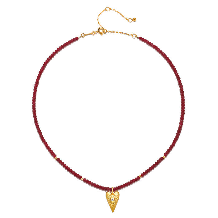 The Healing Heart Red Onyx Heart Necklace styled with an adjustable chain, showcasing the elegance of the red onyx and gold heart pendant. This meaningful necklace is ideal for meditation and serves as a talisman for spiritual growth.