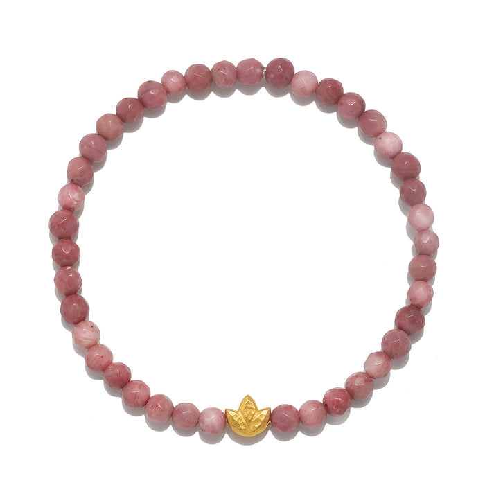 Healing Journey Rhodonite Stretch Bracelet featuring beautifully faceted rhodonite beads with a golden lotus flower accent, symbolizing new beginnings and spiritual growth. Ideal for meditation, this piece serves as a meaningful talisman for protection and manifestation, connecting the wearer to their inner journey and enhancing their yoga practice.