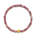 Healing Journey Rhodonite Stretch Bracelet featuring beautifully faceted rhodonite beads with a golden lotus flower accent, symbolizing new beginnings and spiritual growth. Ideal for meditation, this piece serves as a meaningful talisman for protection and manifestation, connecting the wearer to their inner journey and enhancing their yoga practice.