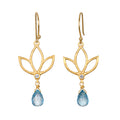 Ignite Renewal Blue Topaz Lotus Drop Earrings featuring a beautiful lotus design with sparkling blue topaz, perfect for those seeking spiritual jewelry. This meaningful piece symbolizes transformation and renewal, making it an ideal talisman for meditation and manifestation. Ideal for yoga enthusiasts and zodiac lovers, the earrings embody the essence of protection and harmony under the sun and moon.