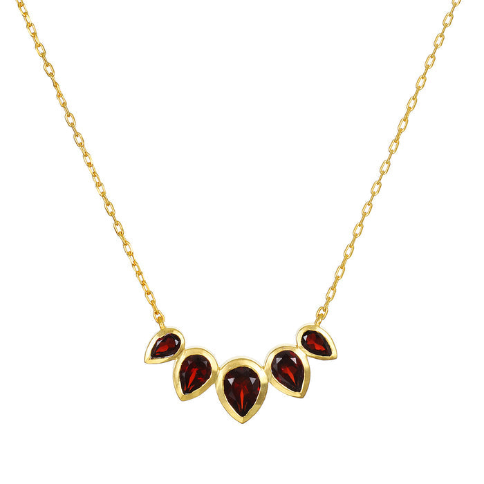 Ignite Strength Garnet Petal Necklace featuring five garnet lotus petals set in 18kt gold plate, a beautiful piece of spiritual jewelry symbolizing grounding energy and transformation, perfect for meditation and manifestation.