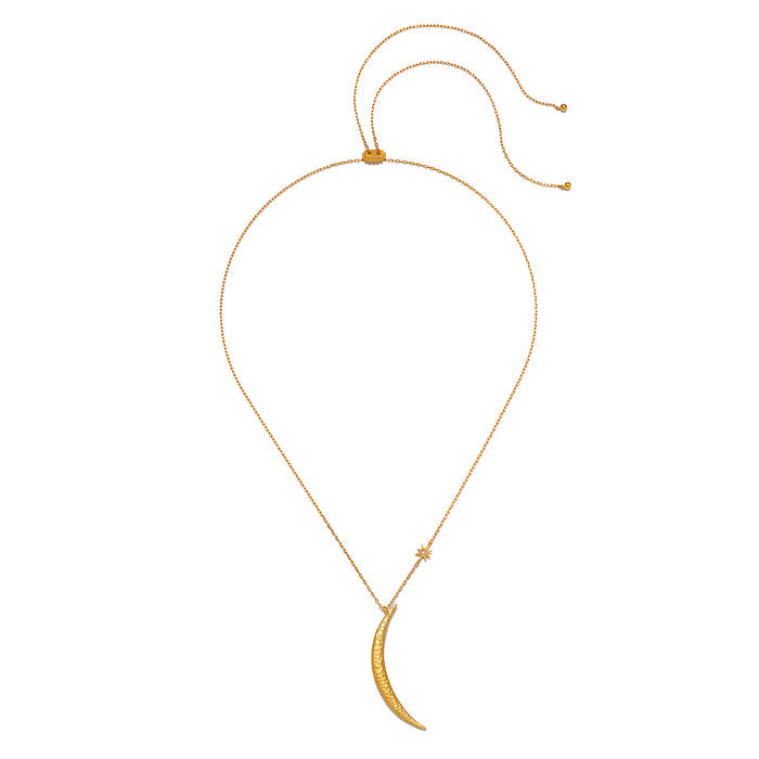 The Illuminated Path Gold Moon Necklace laid flat, showcasing its adjustable design with a crescent moon and star. This spiritual jewelry serves as a talisman for protection and is a beautiful symbol for those into meditation, yoga, and manifestation practices.