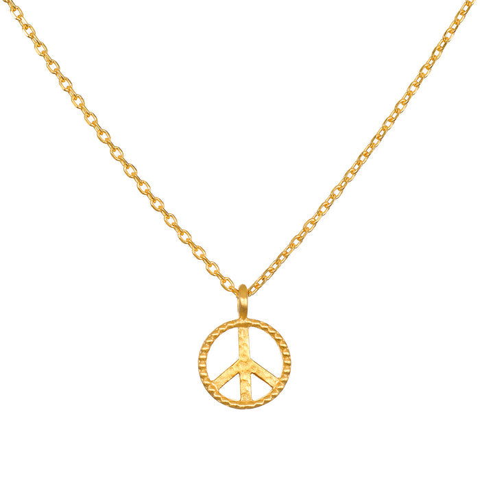 In Pursuit of Peace Necklace featuring a gold peace insignia on a delicate chain, embodying spiritual jewelry and meaning for meditation and manifestation.