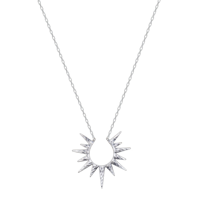 Incandescent Glow Silver Starburst Necklace showcased on a white background. This stunning spiritual jewelry features a starburst design symbolizing the sun, perfect for meditation and manifestation. Ideal for those who seek protection and charm in their yoga practice.