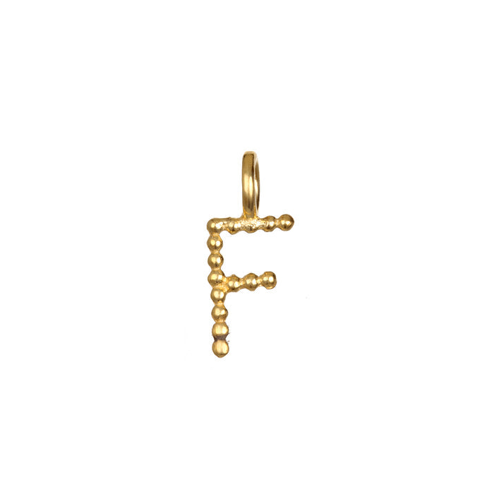 Stylish Initial Letter Charm 'F' in 18kt gold plating, celebrating individuality and spirituality. This charm serves as a talisman for meditation and meaningful connections while enhancing your yoga and spiritual jewelry collection.