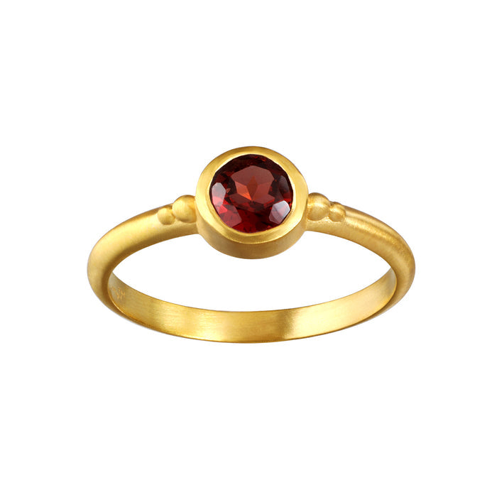 Inner Fire Garnet Ring featuring a bezel set red garnet on an 18kt gold plate band, representing grounding energy, love, and internal fire. Perfect for spiritual jewelry and meditation practices, its meaningful design serves as a talisman for manifestation.