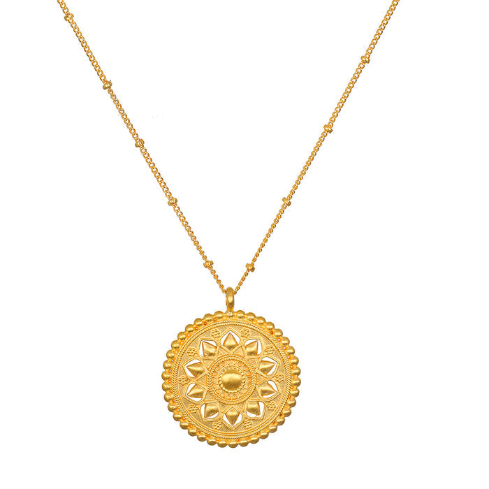Inner Light Mandala Necklace featuring an intricate mandala pendant, a symbol of spiritual meaning and protection, ideal for meditation and manifestation. This spiritual jewelry shines with a gold plate finish, perfect for yoga enthusiasts.