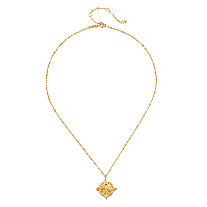 Gold-tone necklace with delicate chain and circular mandala pendant featuring white topaz center stone.