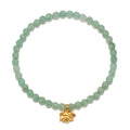 Inspired Spirit Bracelet featuring green aventurine beads and a gold lotus pendant. This beautiful piece of spiritual jewelry promotes balance and creativity, making it perfect for meditation and manifestation. Ideal for yoga enthusiasts and those seeking meaningful protection talismans.