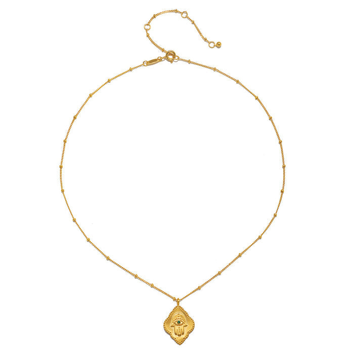 Single necklace from the Intention of Blessings Necklace Set featuring a hamsa pendant in 18kt gold plate, symbolizing blessings and protection. Perfect for spiritual enthusiasts, this piece enhances meditation and is meaningful in its representation of wellness.