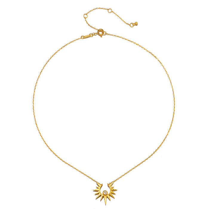 Gold-toned chain necklace with sun pendant and adjustable clasp closure.
