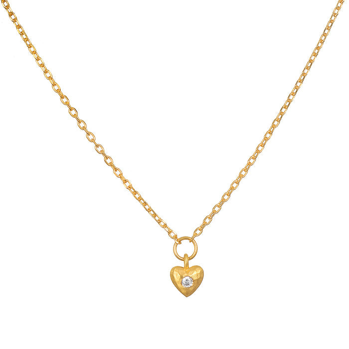 Boundless Love Mini Heart Pendant Necklace on a delicate chain, featuring a hammered 18kt gold plated heart pendant adorned with white topaz, embodying spiritual jewelry with charm and meaning for meditation and manifestation.
