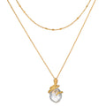 Two-layered gold chain necklaces with faceted clear stone pendant wrapped in textured gold detailing.