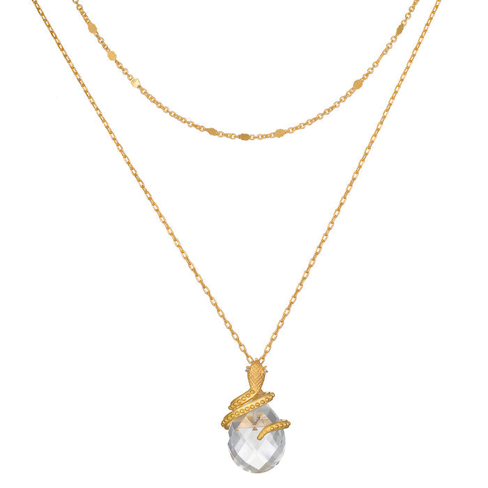 Two-layered gold chain necklaces with faceted clear stone pendant wrapped in textured gold detailing.