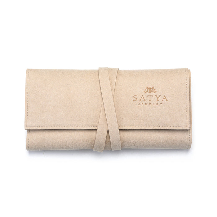 Journey Abroad Travel Wrap by Satya Jewelry, designed to protect your spiritual jewelry, including talismans and malas, with a soft microfiber finish. Ideal for carrying meaningful pieces like zodiac symbols, this packable holder offers protection for your favorites during yoga and meditation practices.
