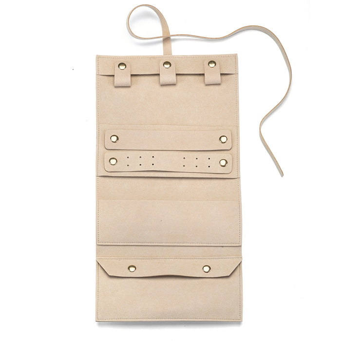 Journey Abroad Travel Wrap, a stylish and protective jewelry case crafted from super soft pink microfiber. Perfect for securing your spiritual jewelry and meaningful talismans while traveling, this wrap offers designated spaces for necklaces, earrings, rings, and more. Ideal for those who practice meditation, yoga, or seek protection and manifestation through their accessories.