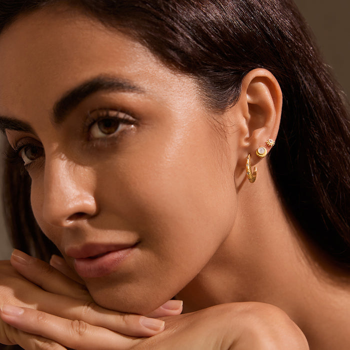 Kindred Spirits Sparkling Moon Hoops showcased on a model, highlighting the elegance of these zodiac-inspired earrings. Perfect for those seeking spiritual protection and a connection to the moon, these hoops embody the essence of yoga and meaningful self-expression.