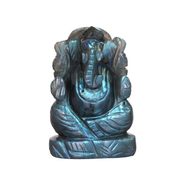 A small statue of the Hindu deity Ganesha carved from labradorite stone with a blue tint.