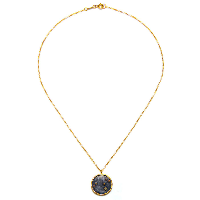 Close-up of the Leo Zodiac Necklace on a gold chain, highlighting its sacred pendant. This piece of spiritual jewelry is ideal for those seeking meaningful connections in meditation and yoga practices, offering a protective and symbolic touch.
