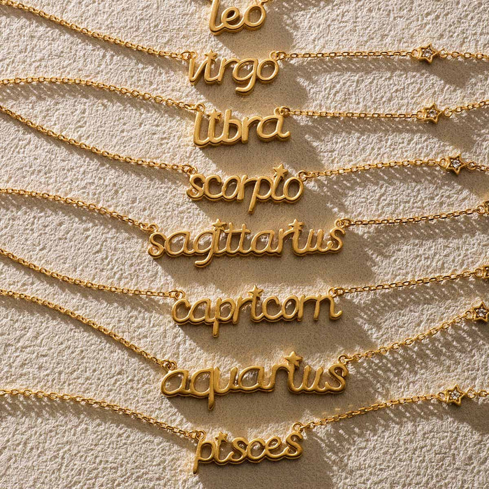 A collection of zodiac script necklaces showcasing the words of various signs including 'libra', designed for spiritual and yoga practices, serving as meaningful talismans for manifestation, harmony, and meditation.