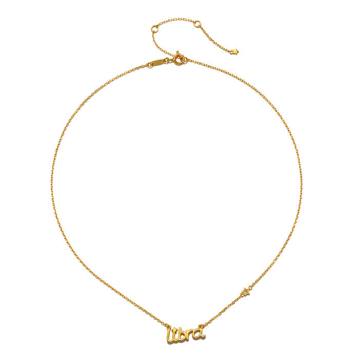 Libra Harmony Zodiac Script Necklace featuring delicate gold plating, symbolizing grace and balance in spiritual jewelry, ideal for meditation and manifestation. This meaningful talisman represents the Libra zodiac, perfect for yoga practitioners seeking harmony and protection.