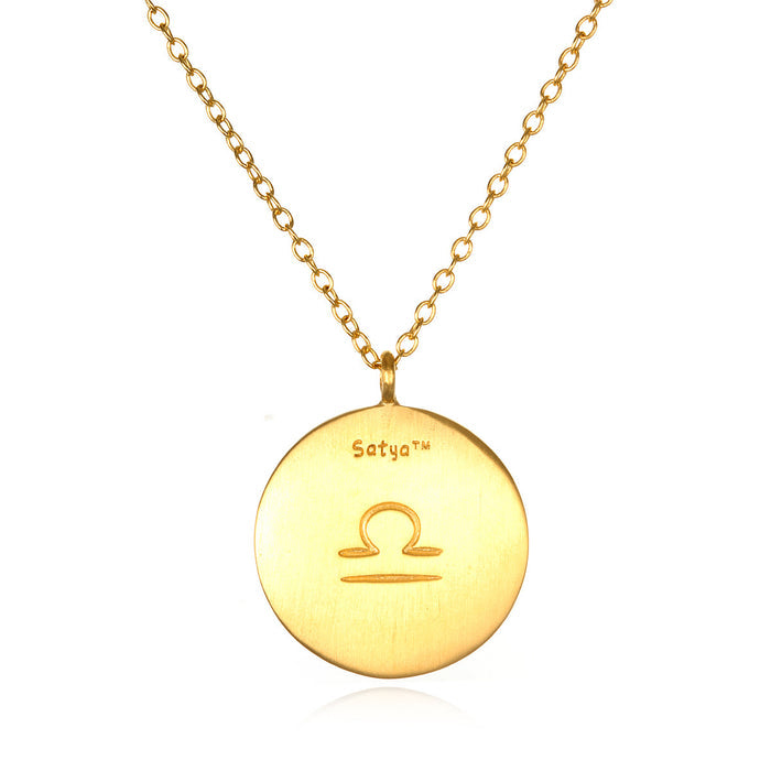 Close-up of the Libra Zodiac Necklace with a classic gold finish and zodiac symbol, representing strength and meaning in spiritual jewelry. A symbolic piece perfect for manifestation and meditation.