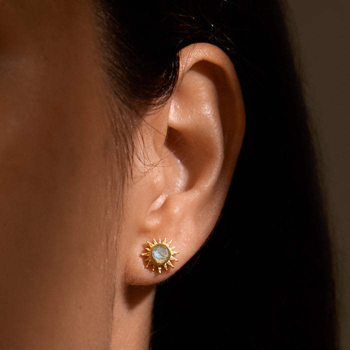 Close-up of Light Seeker Labradorite Starburst Earrings worn, showcasing their beauty and depth, ideal for spiritual jewelry lovers and those interested in zodiac meaning and manifestation through their accessories.