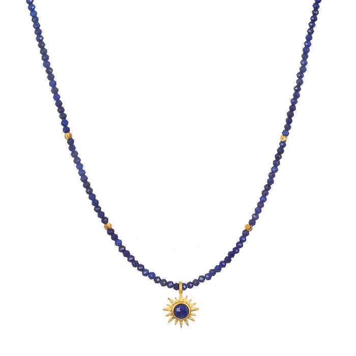 Light Seeker Lapis Starburst Choker Necklace featuring a stunning starburst lapis pendant amidst golden rays, perfect for spiritual jewelry and meditation practices. This elegant piece symbolizes protection and power, embodying the sun's vitality and the essence of meaningful manifestations.