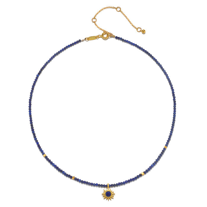 Close-up of the Light Seeker Lapis Starburst Choker Necklace highlighting the intricate design and lapis beads. This spiritual jewelry piece carries the meaning of vitality and protection, making it ideal for meaningful manifestation and zodiac practices.