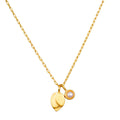 Gold chain necklace with lotus-shaped pendant and pearl charm in gold setting.