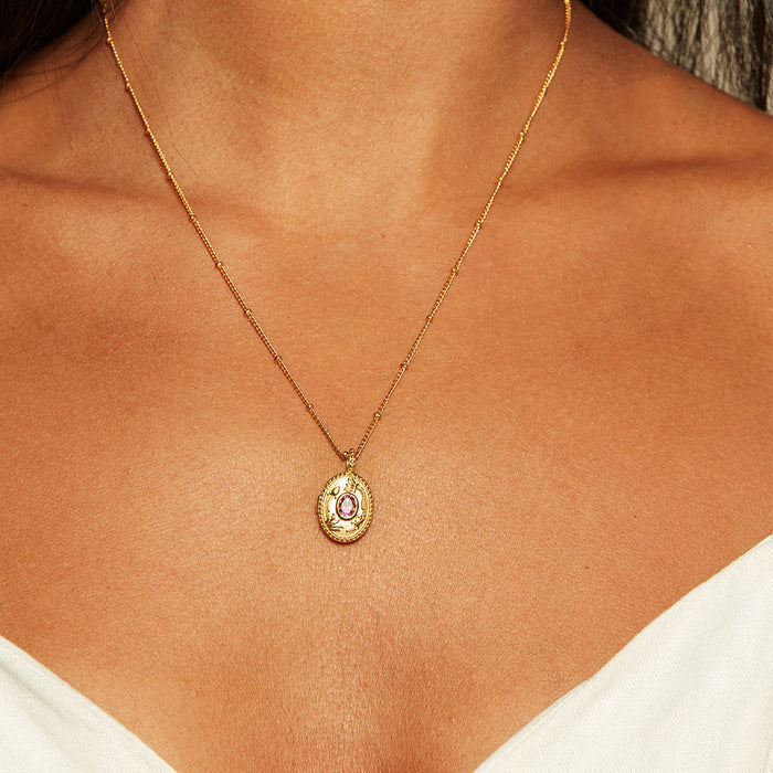 Close-up view of the Lotus Garnet Birthstone Locket Necklace - January worn on the neck, showcasing its meaningful design and charm, ideal for those seeking spiritual connections and protection during yoga or meditation.