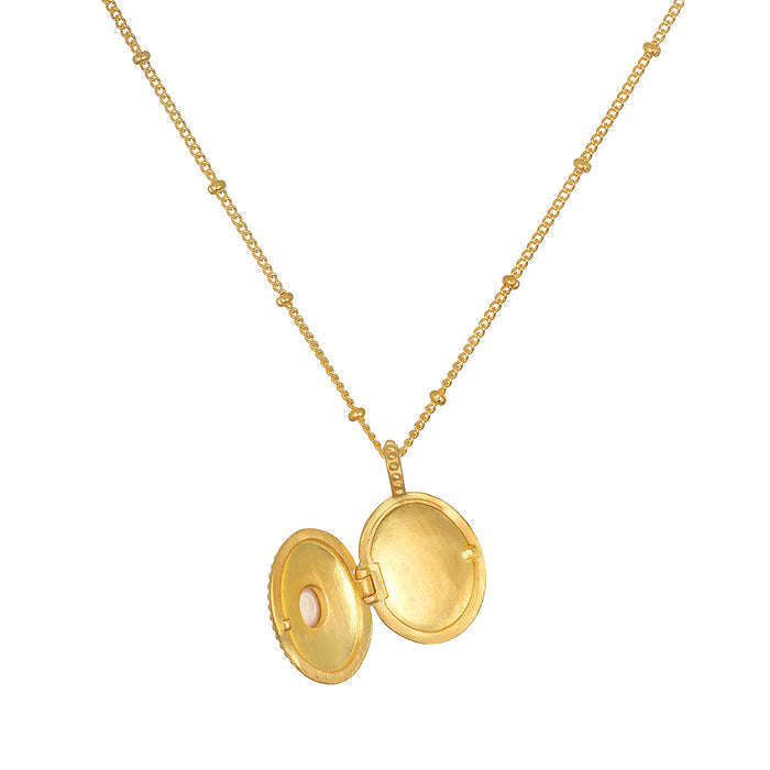 Open view of the Lotus Pearl Birthstone Locket Necklace - June, highlighting its ability to serve as a talisman and a source of spiritual meaning within meditation and protection rituals.