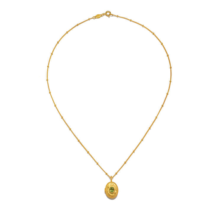 Lotus Peridot Birthstone Locket Necklace - August captured flat lay, featuring its intricate design that embodies protection and charm, making it a thoughtful gift for those seeking meaning and connection.