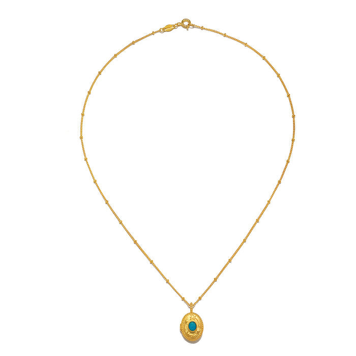 Flat lay of the Lotus Turquoise Birthstone Locket Necklace - December, elegantly displayed to highlight its unique design and craftsmanship. This spiritual jewelry piece is a perfect meditation talisman, ideal for those who cherish meaningful adornment.