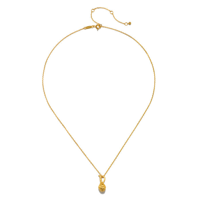 The Love Potion Lotus Vessel Necklace displayed elegantly on a plain background, highlighting its stunning gold finish and lotus design. This exquisite spiritual jewelry serves as a meaningful talisman for those interested in spirituality and meditation, ideal for enhancing one's yoga practice and personal protection through its symbolism of abundance.