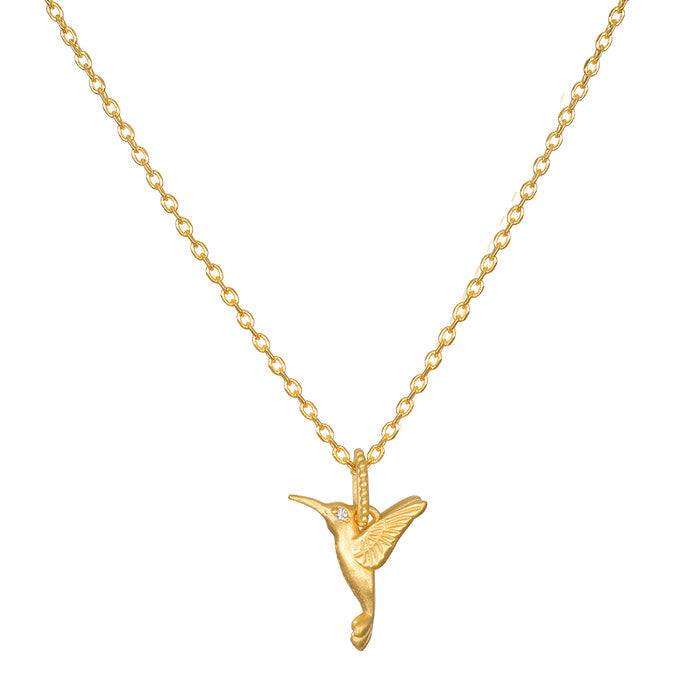 The Loving Devotion Hummingbird Necklace by Satya Jewelry showcases a graceful hummingbird pendant in 18kt gold plate, symbolizing good luck, peace, and devotion, making it a perfect piece of spiritual jewelry for meditation and personal manifestation.