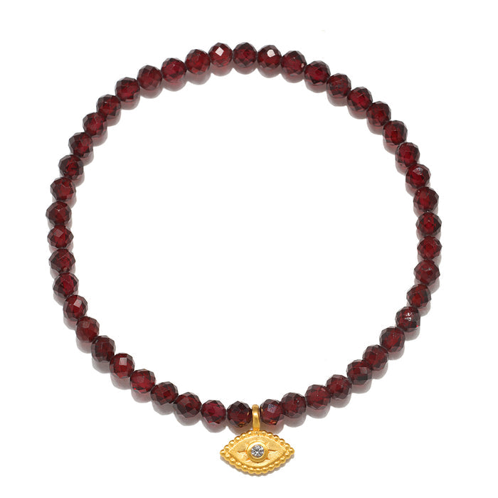 Loving Protection Garnet Evil Eye Bracelet featuring faceted red garnet beads and an 18kt gold plate evil eye charm, symbolizing protection and intuition. This spiritual jewelry is perfect for meditation and manifestation, connecting with the universe through its meaningful design. Ideal for yoga practitioners and those interested in zodiac and talismans.