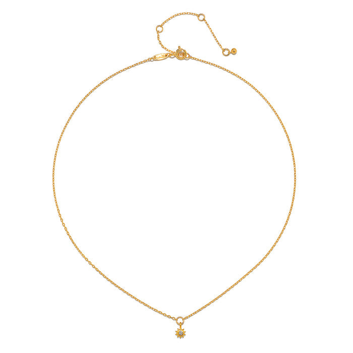 Close-up of the Lucent Spirit Mini Sun Pendant Necklace, emphasizing its intricate design and 18KT gold plating. This eye-catching spiritual jewelry piece embodies the essence of the sun, symbolizing life and creativity, making it a perfect addition to your collection of talismans for meaningful meditation and manifestation.