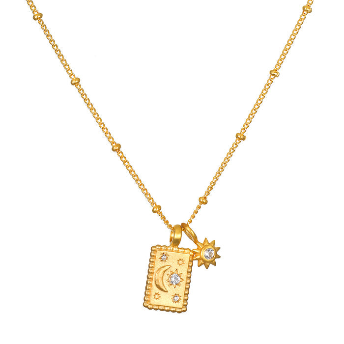 Magic in Moonlight Necklace featuring a crescent moon and star charms, made with 18kt gold plating, symbolizing creativity and spiritual protection. Perfect for meditation and yoga enthusiasts seeking meaningful jewelry for manifestation.