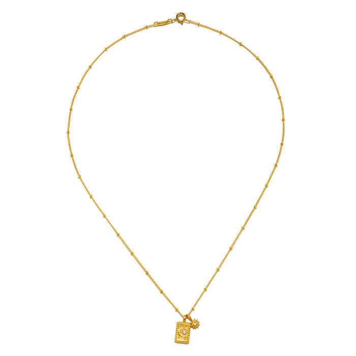 Magic in Moonlight Necklace displayed elegantly, showcasing its exquisite design with 18kt gold plating, ideal for yoga practitioners seeking meaningful spiritual jewelry that embodies the essence of the sun and moon.