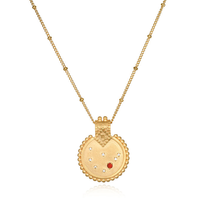 Mandala Zodiac Capricorn Red Garnet Necklace featuring intricate gold craftsmanship, perfect for spiritual jewelry and meditation gifts. This necklace serves as a meaningful and protective amulet, symbolizing the Capricorn zodiac sign and enhancing your yoga practice and manifestation goals.