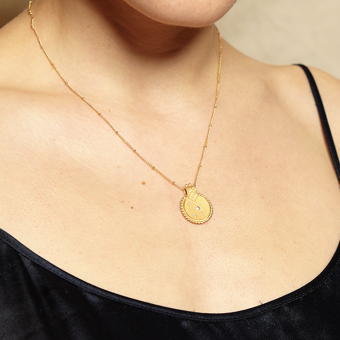 Close-up of the Mandala Zodiac Libra Pink Tourmaline Necklace worn on a model, showcasing its spiritual significance and charm, ideal for those interested in protection, yoga, and zodiac symbolism.